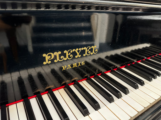 Pleyel Paris fallboard decal and keyboard on a polished ebony grand piano