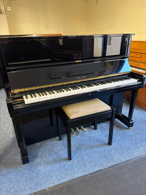 Sojin RS21 full-size upright piano in polished ebony with stool at The Piano Gallery showroom